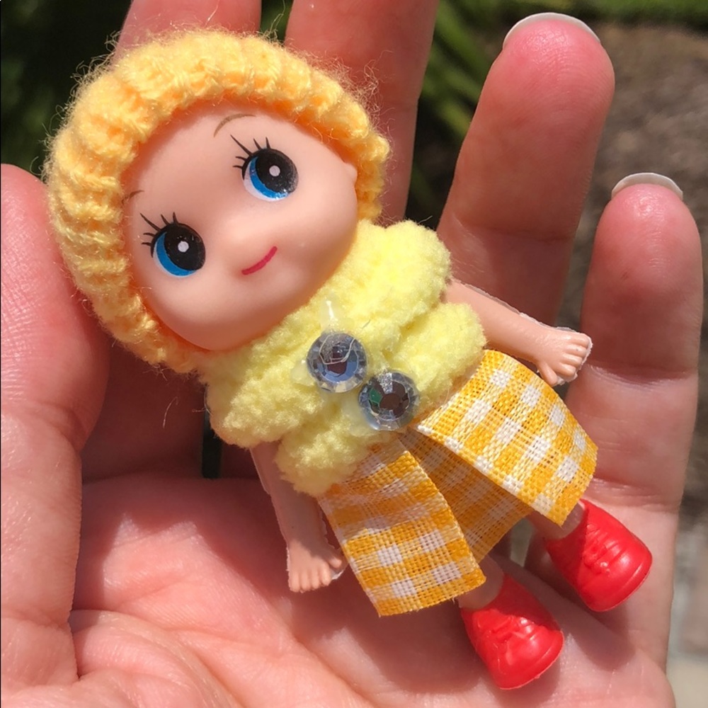 Baby elf doll yellow cute on a shelf toddler